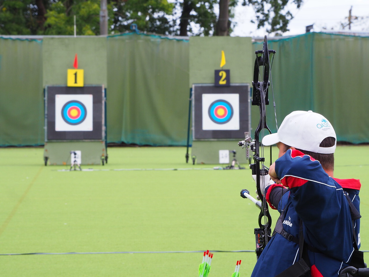 Archer doing target archery with a compound bow